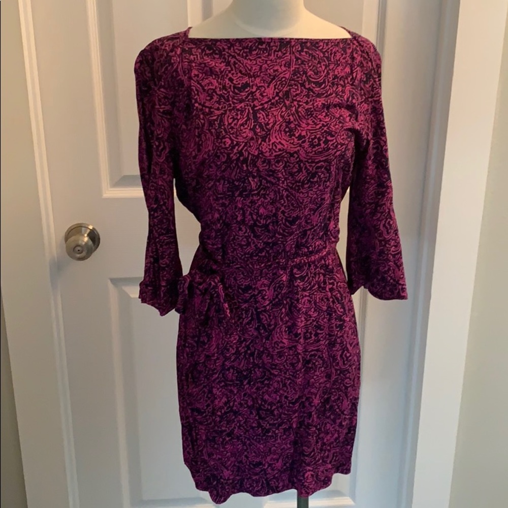 Bell sleeve boat neck dress.